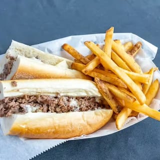 12" Cheesesteak with Fries and Can of Soda