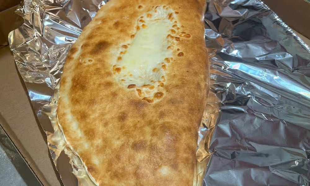 Small 1. Cheese Trio Calzone.